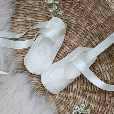 Christening booties with ribbon ties